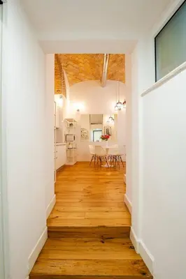 an open hallway with white walls and wood floors at Via Veneto Luxury Loft in Rome