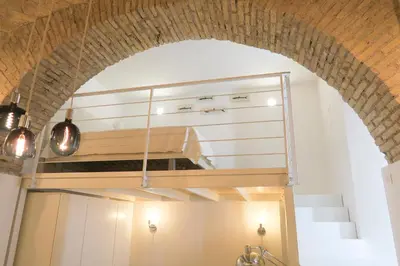 a kitchen with an oven in the middle of a room at Via Veneto Luxury Loft in Rome