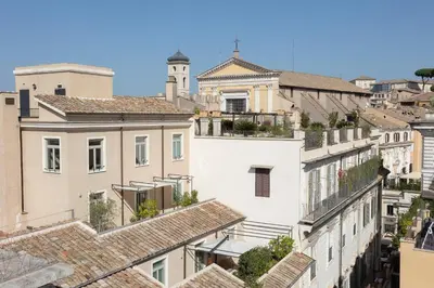 a view of roofs of buildings in a city at Amazing Piazza Venezia with Jacuzzi and terrace in Rome