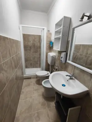 a bathroom with a toilet and a sink at B&B Bella Garbatella in Rome