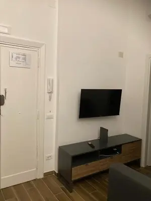 a living room with a flat screen tv on a wall at Welcome to Rome Baldo in Rome
