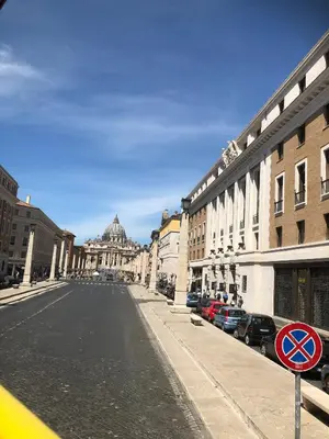 an empty street in a city with a building at Welcome to Rome Baldo in Rome