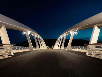 a bridge with lights over a road at night at Casa Vasari in Rome
