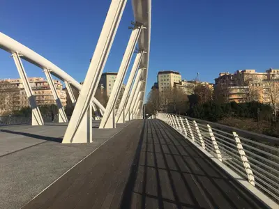 a bridge over a river with buildings in the background at Casa Vasari in Rome
