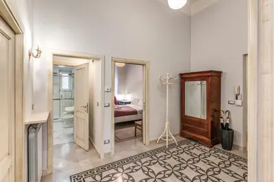a room with a bathroom with a bed and a mirror at Montebello Apartments79 in Rome
