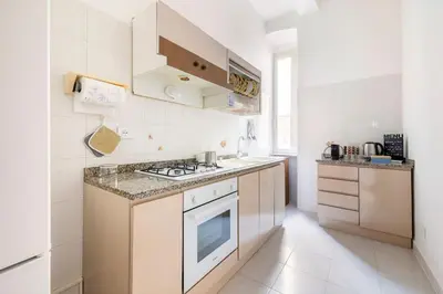 a building with a brown door on a street at Casa amoR in Trastevere in Rome