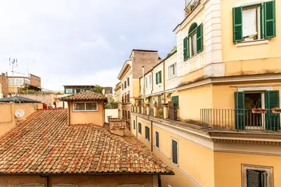a view of an alley with buildings and roofs at iFlat Homey in Campo de'Fiori in Rome
