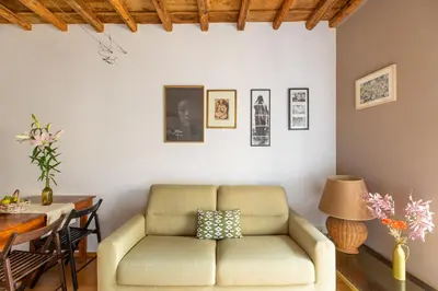 a living room with a couch and a table at iFlat Homey in Campo de'Fiori in Rome