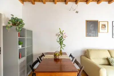 a living room with a table and a couch at iFlat Homey in Campo de'Fiori in Rome