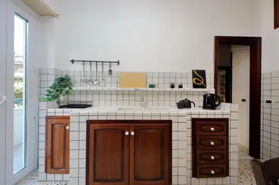 a kitchen with a sink and a counter at Comfy apartment next to Vatican City in Rome