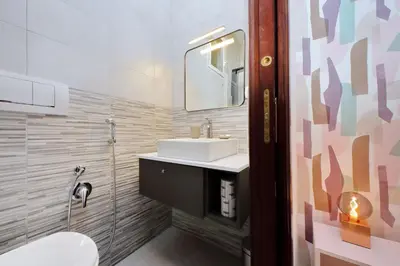 a bathroom with a sink and a mirror at Comfy apartment next to Vatican City in Rome