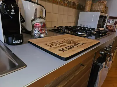 a cutting board sitting on top of a kitchen counter at Domus Ottaviano - Vaticano in Rome