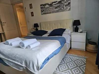 a bedroom with a large bed with towels on it at Domus Ottaviano - Vaticano in Rome