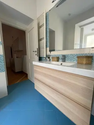 a bathroom with two sinks and a large mirror at Domus Ottaviano - Vaticano in Rome