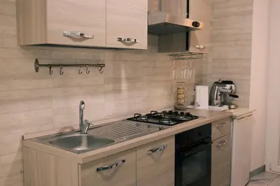 a kitchen with a sink and a stove at Termini Rita House in Rome