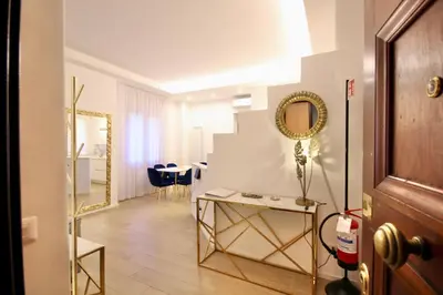 a dressing room with a mirror and a table at HC - Live Doria Luxury Apt by the Vatican in Rome