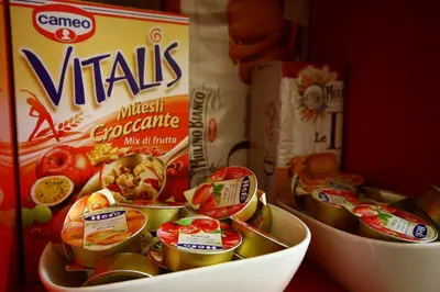 a bowl filled with food next to a box of cereal at Passenger Vatican Relais in Rome
