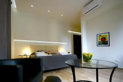 a bedroom with a bed and a glass table at Passenger Vatican Relais in Rome