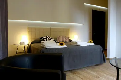 a bedroom with a bed with sunflowers on it at Passenger Vatican Relais in Rome