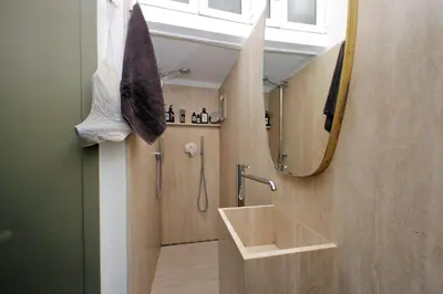 a bathroom with a sink and a mirror at The Eclectic Home of Collector - Navona Square in Rome