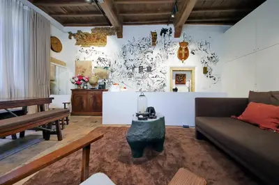 a living room with a couch and a table at The Eclectic Home of Collector - Navona Square in Rome