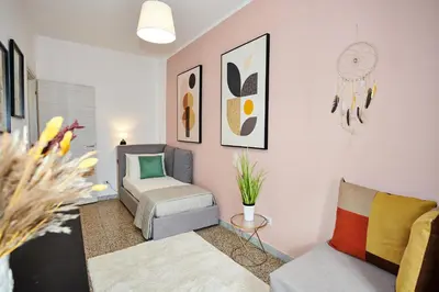 a living room with a couch and a chair at Terrace Penthouse - meospiti Penthouse in Rome