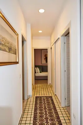 a hallway with a tile floor and a bedroom at Terrace Penthouse - meospiti Penthouse in Rome