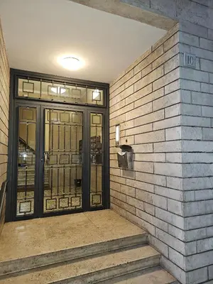 an entrance to a building with glass doors at Terrace Penthouse - meospiti Penthouse in Rome