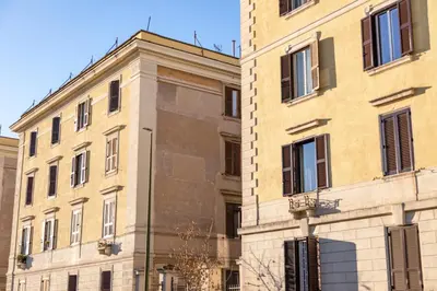 a large building next to a tall building at Testaccio Boutique Apartment in Rome in Rome