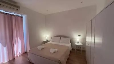 a bedroom with a bed with two towels on it at Dimora di Trastevere in Rome