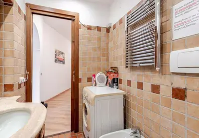 a bathroom with a toilet and a sink at Dimora di Trastevere in Rome