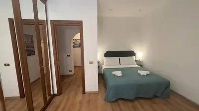 a bedroom with a bed with two towels on it at Dimora di Trastevere in Rome