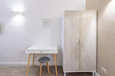 a white desk and a mirror next to a table at Vatican 2BR apartment in Roma in Rome