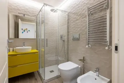 a bathroom with a shower and a toilet and a sink at Vatican 2BR apartment in Roma in Rome