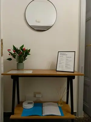 a table with a toilet and a potted plant on it at Rome - Termini House in Rome