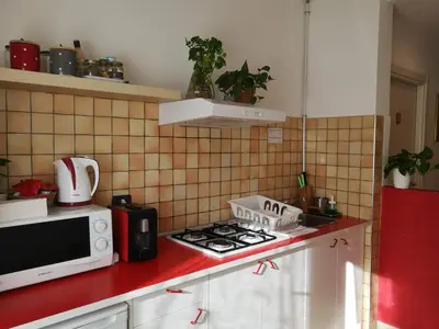a kitchen with a microwave and a stove top oven at Porta Maggiore GH Locazione Turistica in Rome