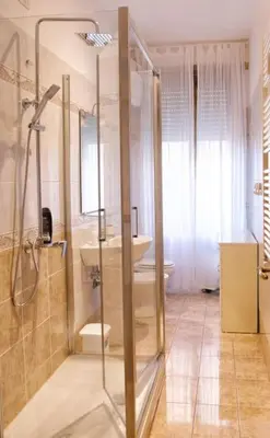 a bathroom with a shower and a sink at AURA APARTMENT in Rome