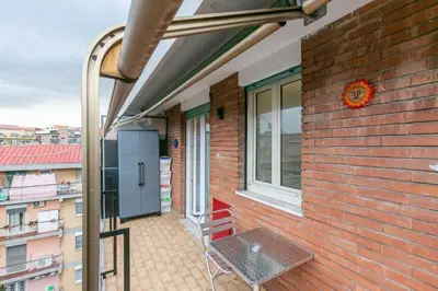 a balcony with a bench and a window at Il rifugio dei nonni by Rentbeat in Rome