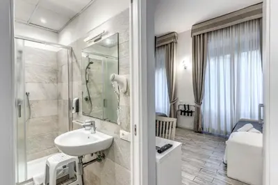 a bathroom with a sink and a shower at Gardenia Suite in Rome