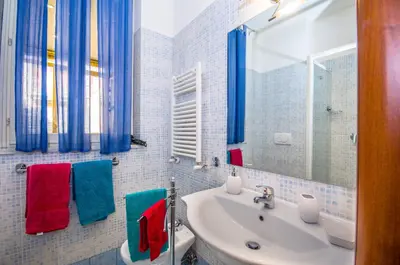 a bathroom with a sink and a mirror at Vatican Penthouse Near S.Peter's Square in Rome