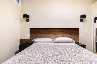 a bedroom with a large bed with two pillows at alloggio la carica dei 101 in Rome