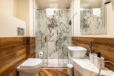 a bathroom with a toilet and a sink and a shower at alloggio la carica dei 101 in Rome