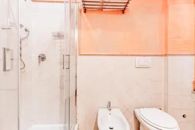 a bathroom with a shower and a toilet and a sink at La Rosa Dei Papi in Rome
