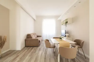 a living room with a table and chairs and a couch at Sweet Rhome to Colosseum in Rome