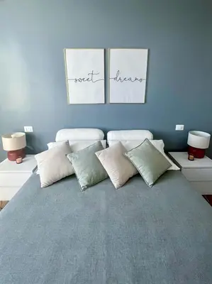 a bedroom with a bed with pillows on it at Cioccis Boutique Apartment in Rome