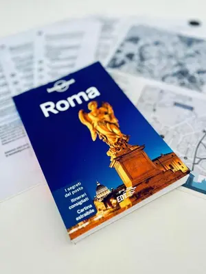 a book on rome on top of a newspaper at Cioccis Boutique Apartment in Rome
