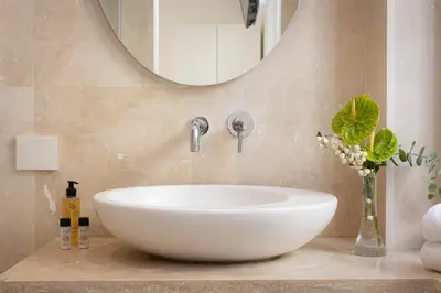 a bathroom with a white sink and a mirror at Amazing Cozy Piazza Venezia in Rome