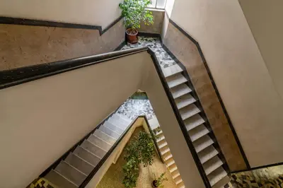 an overhead view of a staircase with potted plants at GIULIANA Boutique Apartment in Rome
