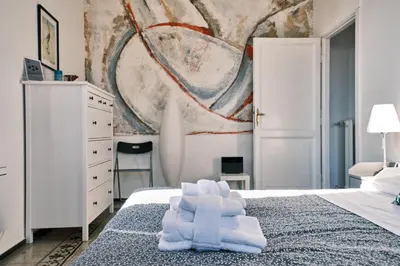 a bedroom with a bed with towels on it at Carolina Trastevere House in Rome