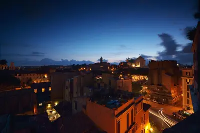 a view of a city at night at Colosseum Colosseo in Rome